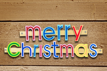 Bright holiday Christmas greeting over wooden background