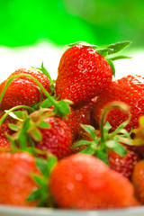 fresh strawberries closeup on the blurry background