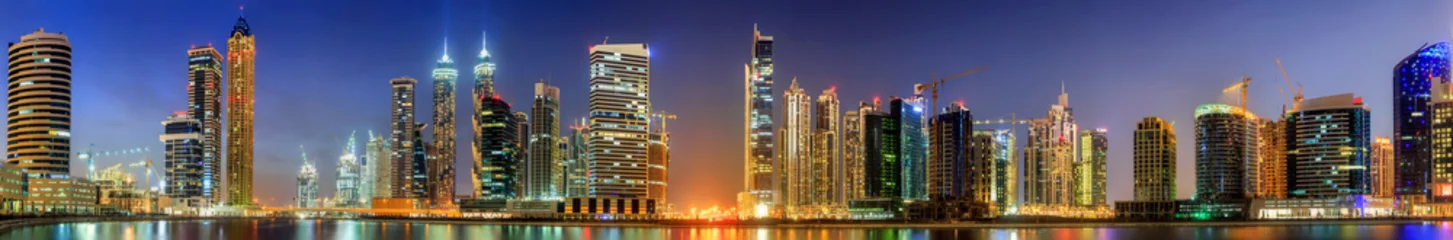 Poster Panoramic view of Business bay and downtown area of Dubai at sunrise, UAE © boule1301