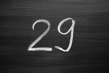 number twenty nine enumeration written with a chalk on the blackboard