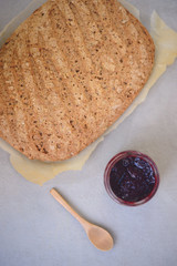 Fresh baked bread on ceramic background background with butter a