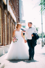 Fototapeta premium bride and groom on the background of the city