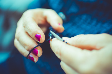 Close-up of hands knitting