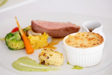 Vegetables baked with cheese and beef, pork, potatoes, vegetable