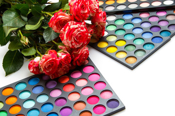 Rose flowers and palettes with eyeshadows