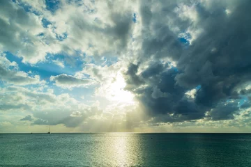 Papier Peint photo Plage de Seven Mile, Grand Cayman sunset over the caribbean sea with stormy skies