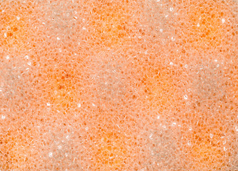 Abstract orange bath sponge texture background
