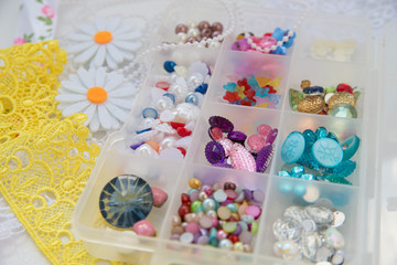Fototapeta na wymiar rhinestones and beads colored