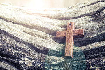 The wooden cross on old  wooden background