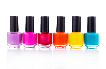 Many multi-colored nail polish. On white, isolated background.