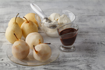 Pears in dark chocolate, sweet dessert set with modern copper co