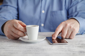businessman drinking espresso coffee in the city cafe during lun