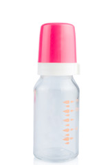 Empty baby feeding bottle with a pink cap. On white, isolated background.