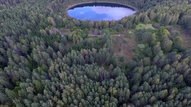 Aerial View on Beautiful Round Lake in a Forest