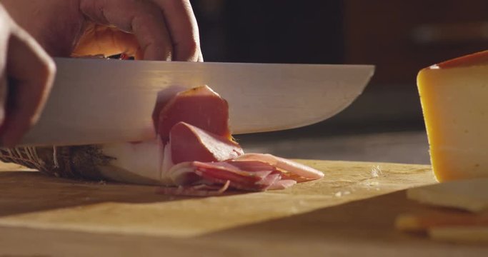 prosciutto di parma's ham professional cut in old traditional italian style 