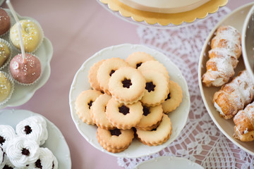 Jam cookies, meringues, cakepops and horn pastries with cream.