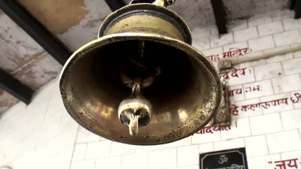 View from the bottom of the metal bell in the hindu temple