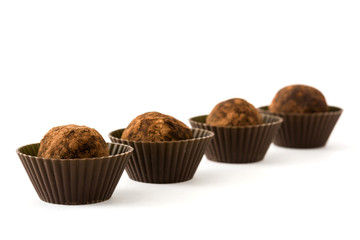 Homemade chocolate truffles isolated on white background

