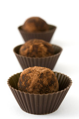 Homemade chocolate truffles isolated on white background


