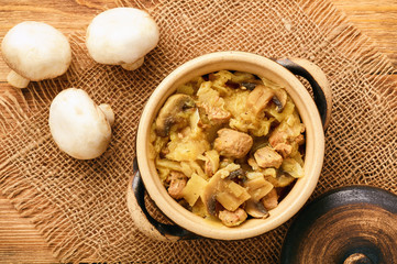 Stewed cabbage with meat and mushrooms.