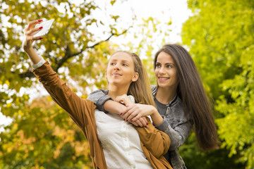 Two young girls in the park.