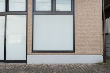 Large blank billboard on a street wall, banners with room to add your own text