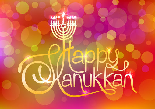 Happy Hanukkah lettering on blur bokeh background.