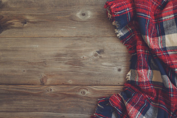 Flat lay view of tartan textured scarf on wooden background with - 124763248