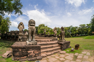 Fototapeta premium Lion and Naga sandstone statue in Phimai historical park.Prasat Hin Phimai Nakhonratchasima Thailand.