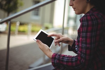Woman using digital tablet