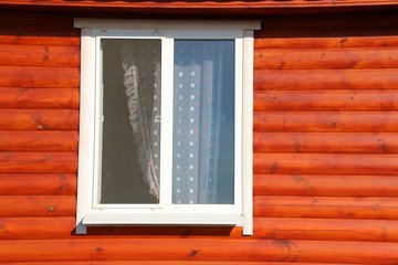 Plastic window of a modern summer cottage