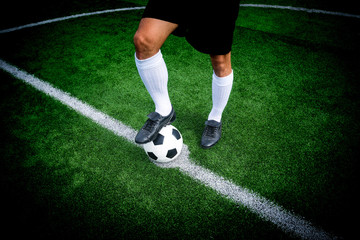 Soccer player ready to play at start kick off point in soccer fi