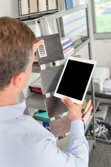 Designer using a tablet computer