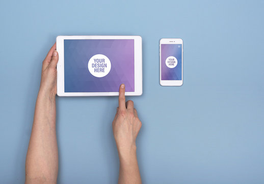 User with Tablet with Smartphone on Blue Background Mockup 