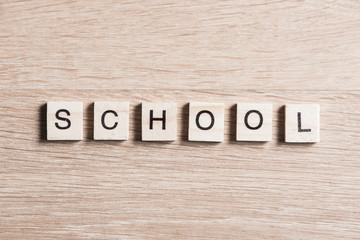 Fototapeta premium wooden elements with letter collected to word school