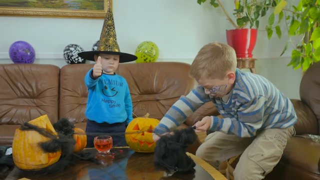 Two little boys have a good time on the Halloween