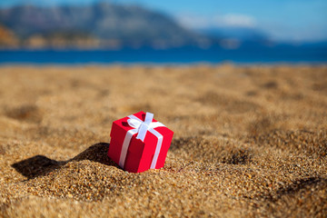 Gift box on a beach