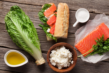 Sandwich with salmon and romaine salad