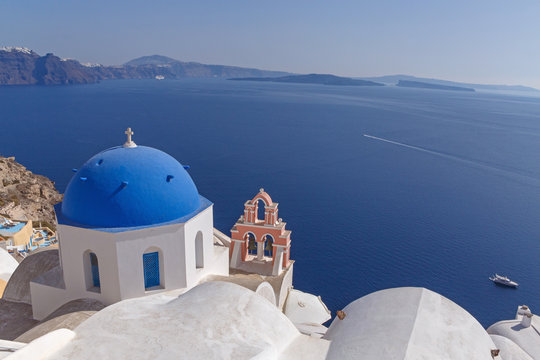 Anastasis church in Oia in front of caldera of Santorini, Greece
