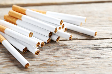 Tobacco cigarettes on a grey wooden table