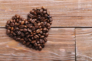 Roasted coffee beans on a brown wooden table
