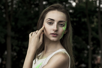 Attractive brunette model with powder Holi on her face