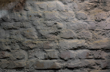 old white brick wall in the dark