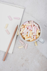 womans office table with coffee and marshmallows