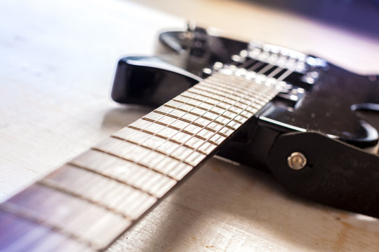 Electric guitar on old wooden surface