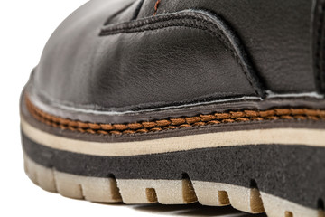 The shoe of needled strong thread, stitch of seam close-up, isol