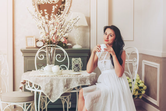 Beautiful Woman With Cup of Tea or Coffee