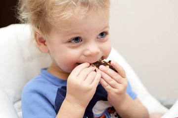 Toddler eating pancake