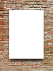 Single blank frame hanged by pegs against brick wall background