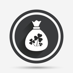 Money bag with three leaves clovers sign.